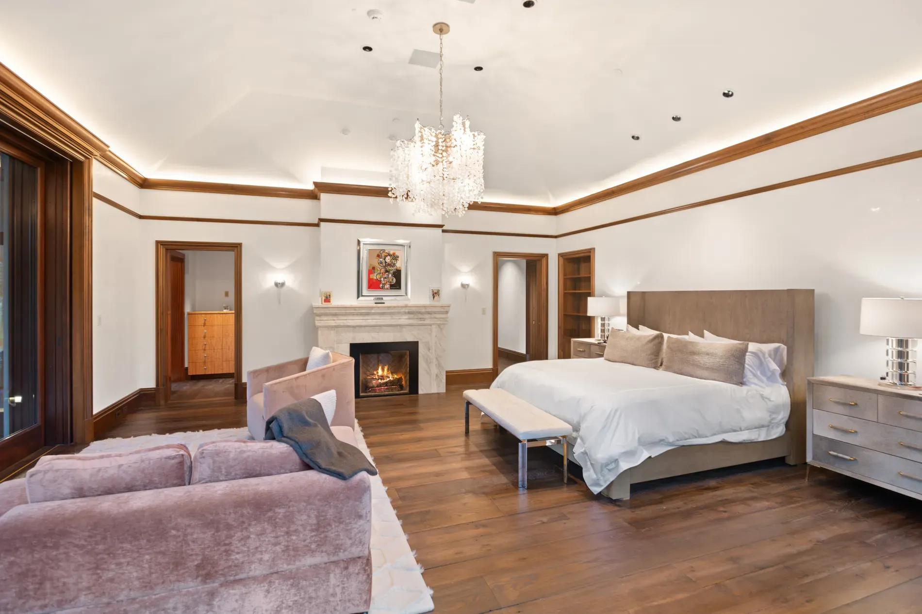 Bedroom keeps it simple—white walls, thick trim. Calm, slightly hotel.