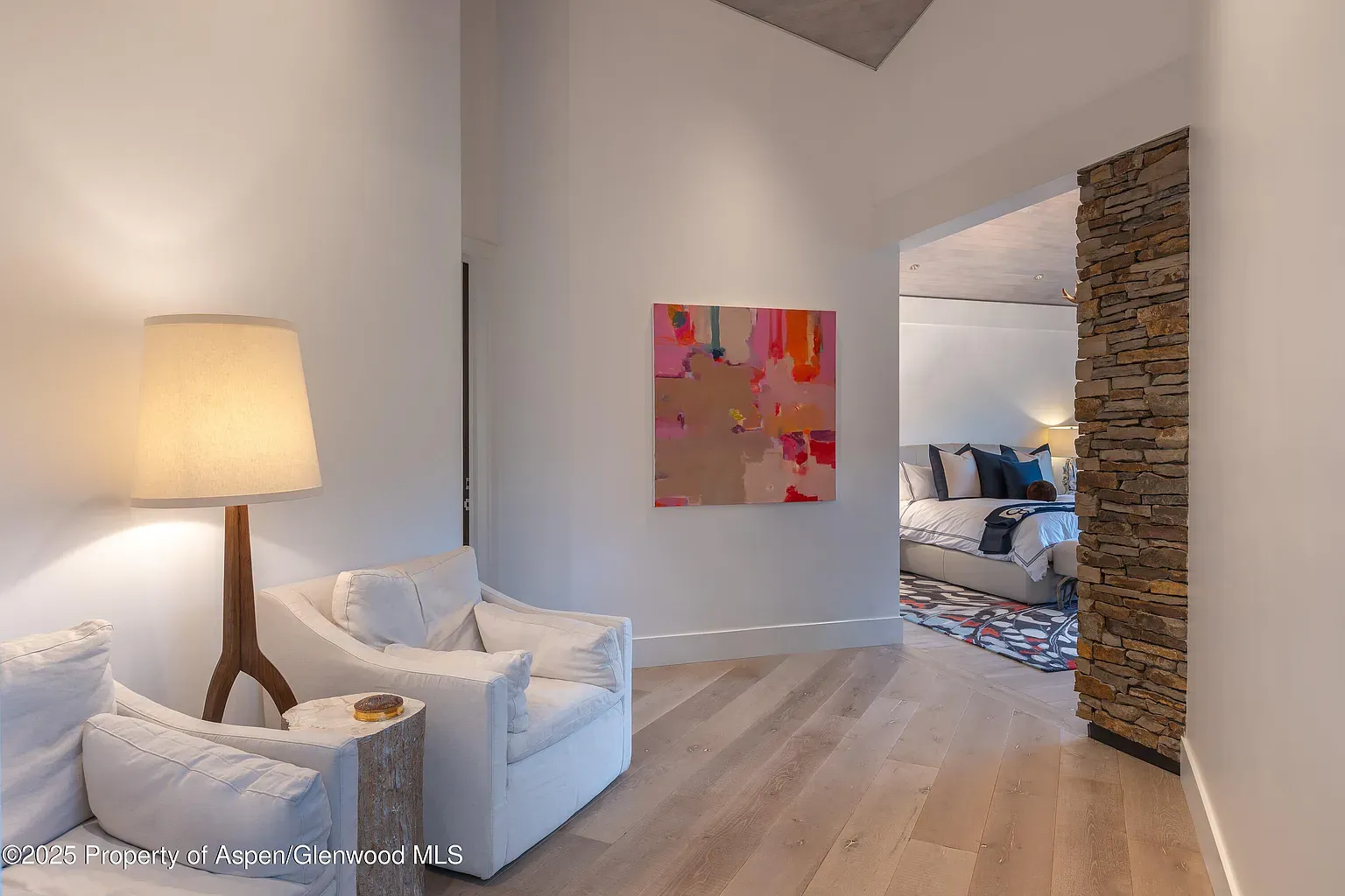 Long, bright hallway with blonde floors. Quiet, gallery vibe without trying.