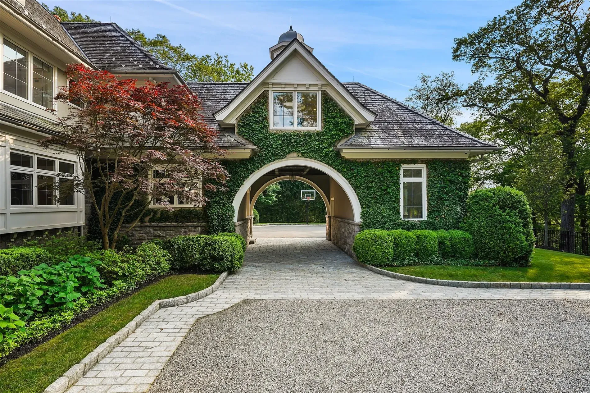 Ivy arch over the door—storybook vibes. Does this need trimming or nah?