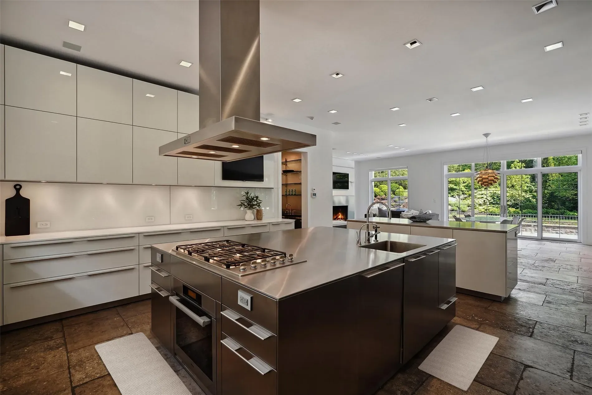 Here's the kitchen—sleek cabinets, steel counters. That island means business.