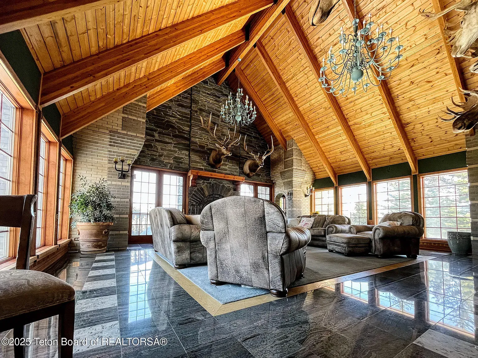 That vaulted ceiling with the beams. Stone walls make it feel cave-cozy.