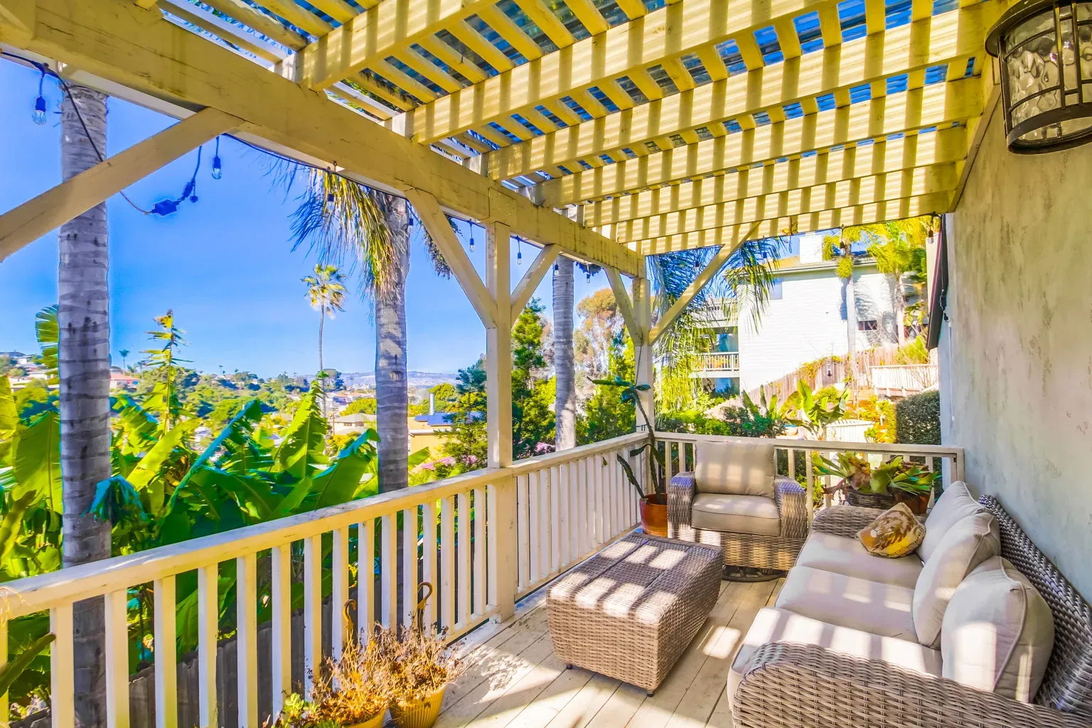 Pergola deck with striped shadows. Can hear iced tea clinking in my brain.
