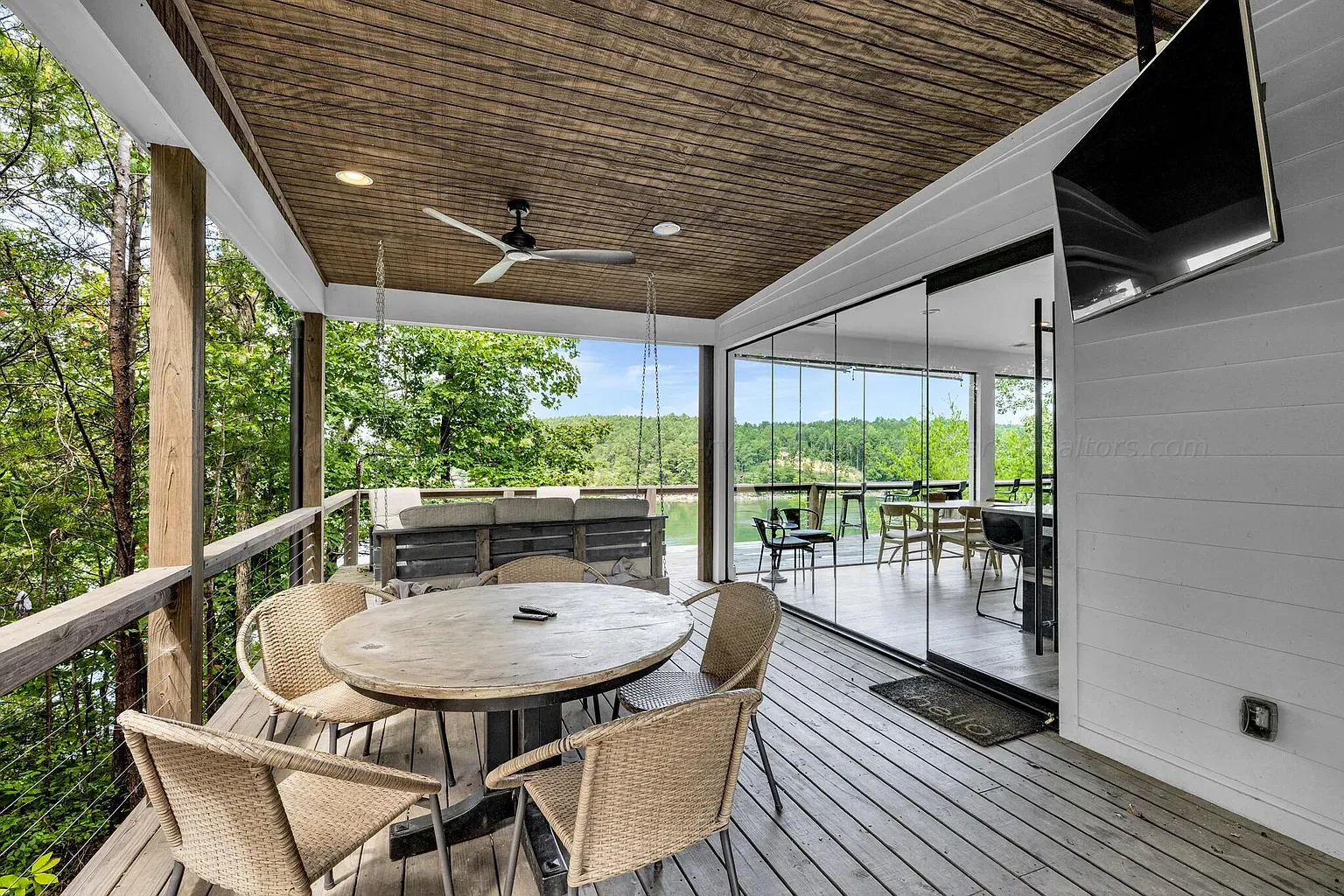 Balcony over the water with warm wood decking. Morning coffee spot unlocked.