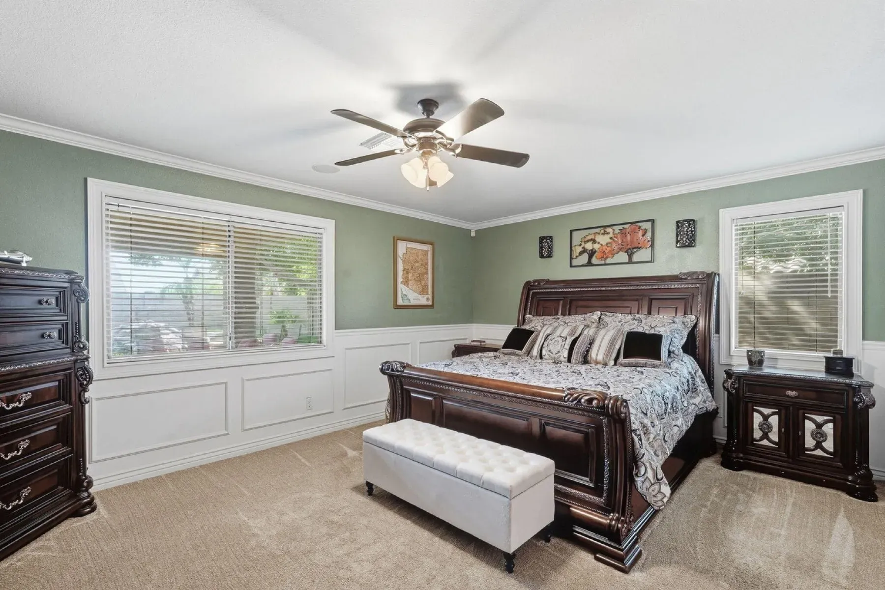 Soft green walls and wainscoting. Feels calm and a little fancy.