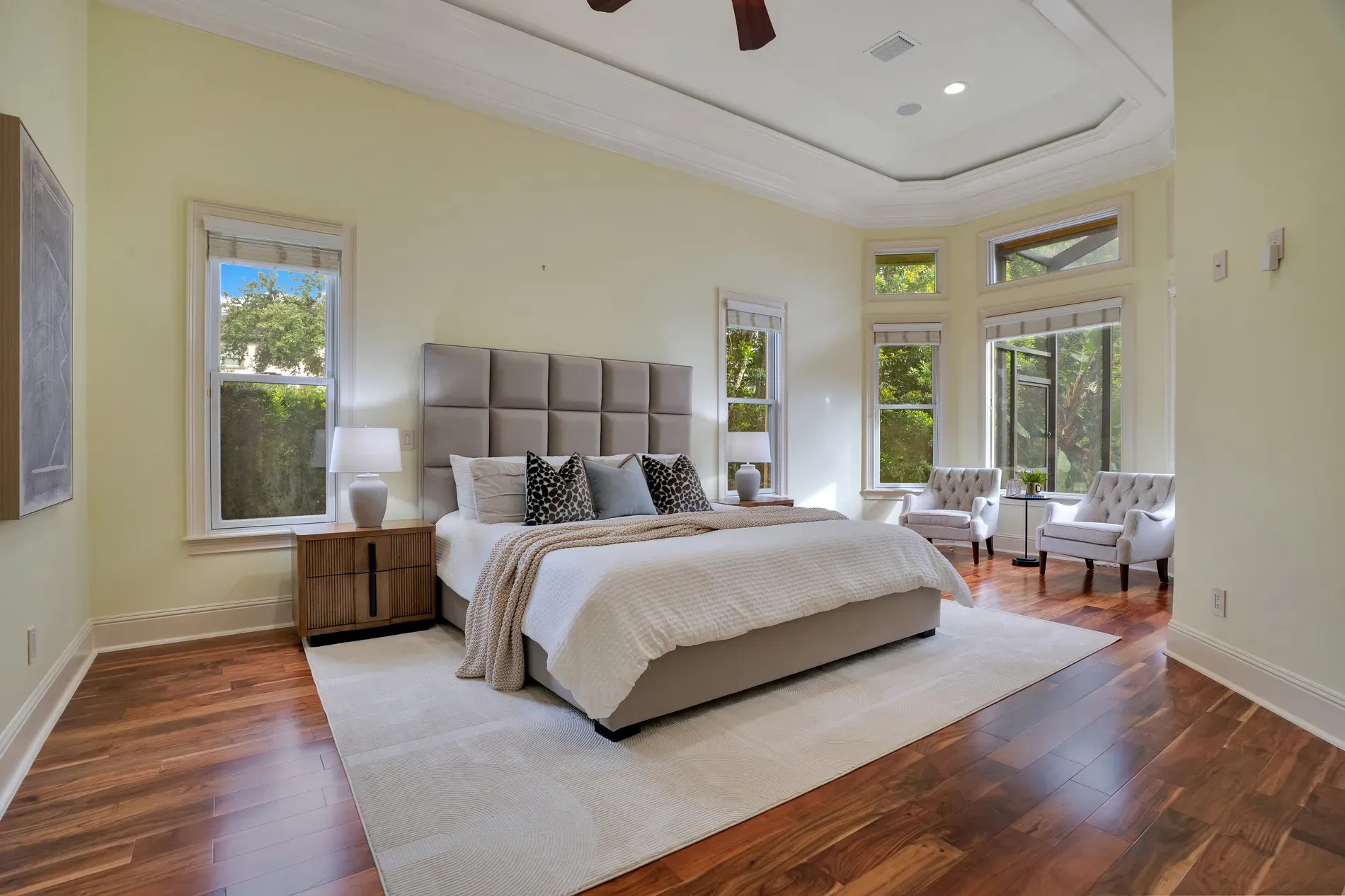 Bedroom goes buttery yellow with shiny hardwoods. Warm and old-school cozy.