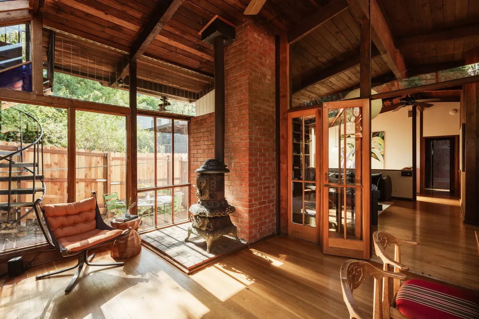 Big open room and that brick hearth steals it. I can hear crackling.