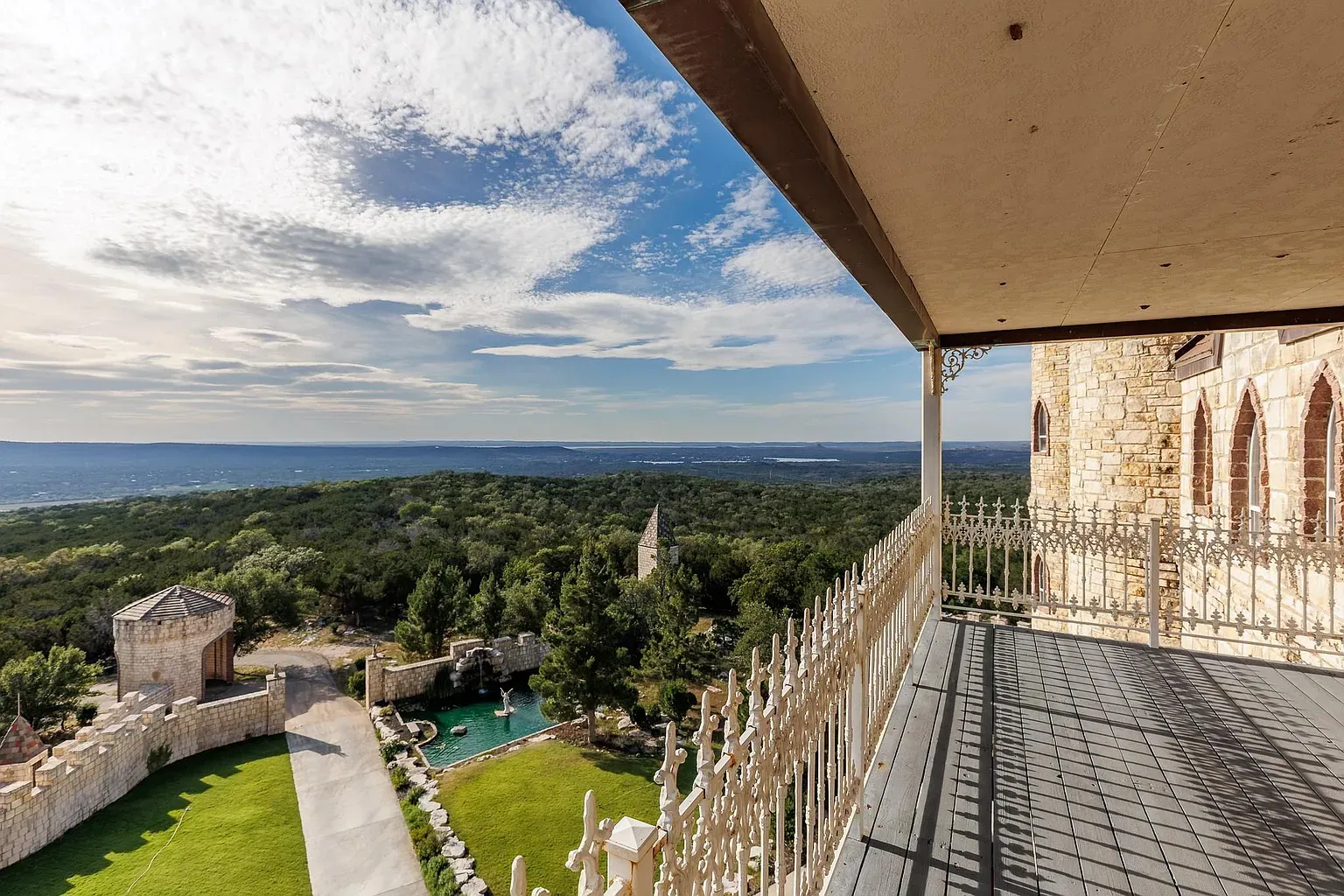 That balcony view goes on forever. Wrought iron railing is a nice touch.