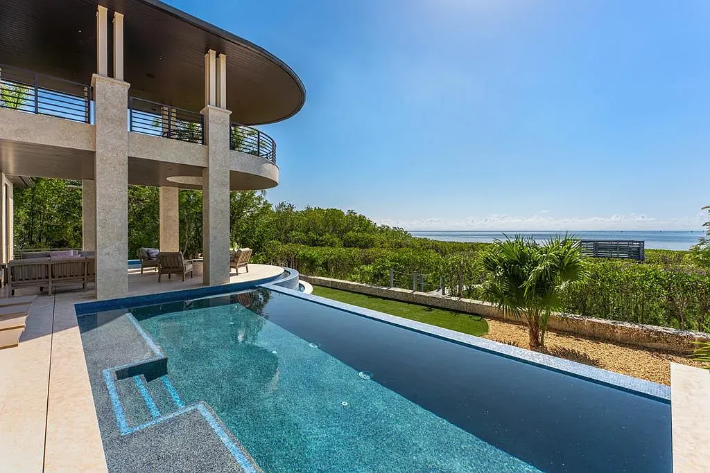 Infinity pool melting into the horizon. Those blue tiles are doing the most.