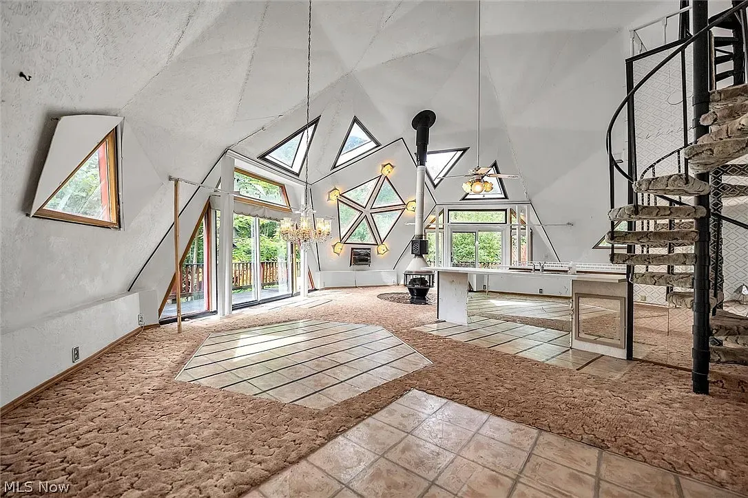 Triangular windows everywhere, plus a spiral staircase. Kind of magical.