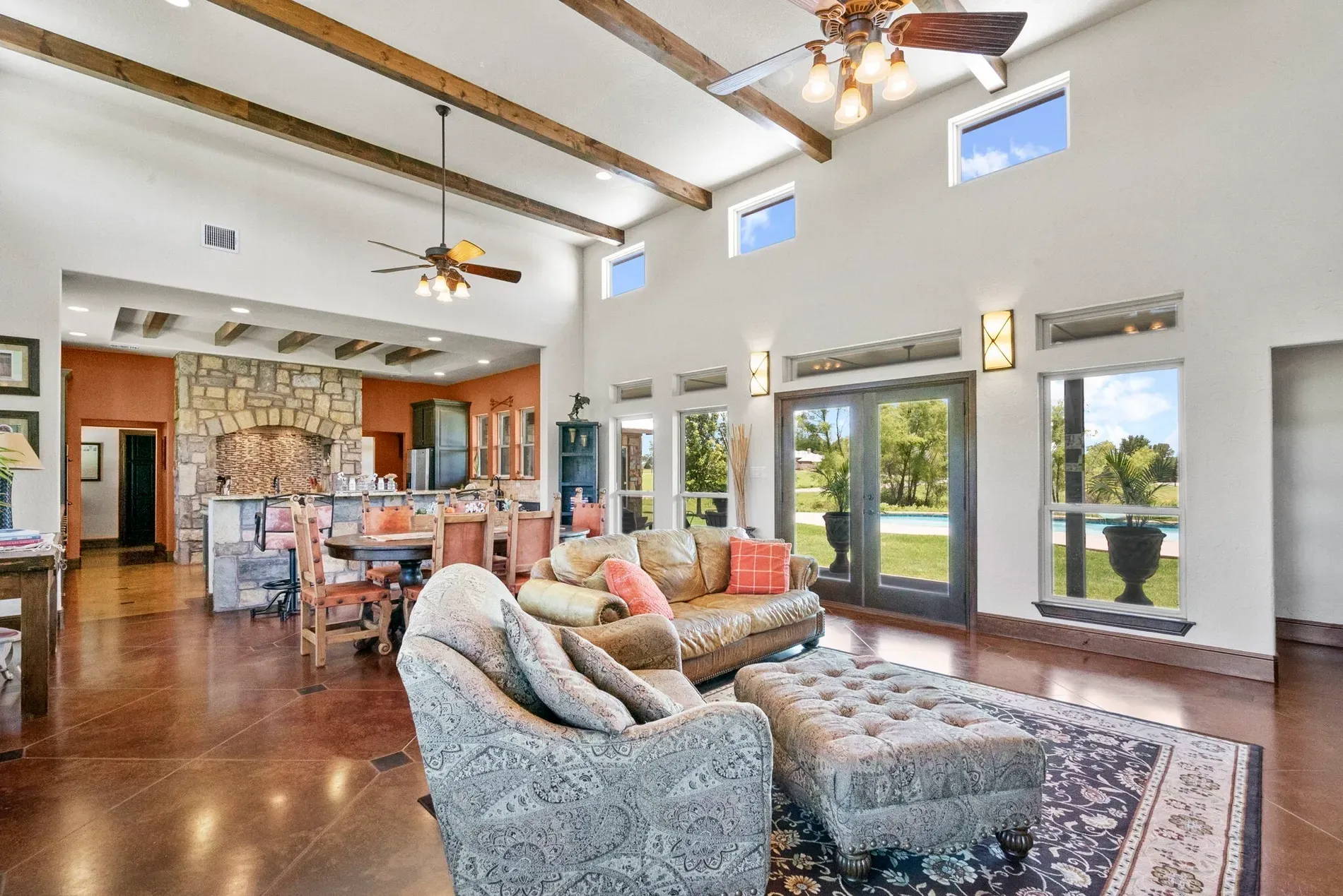 Living room beams for days. Polished concrete floor actually works with the wood.
