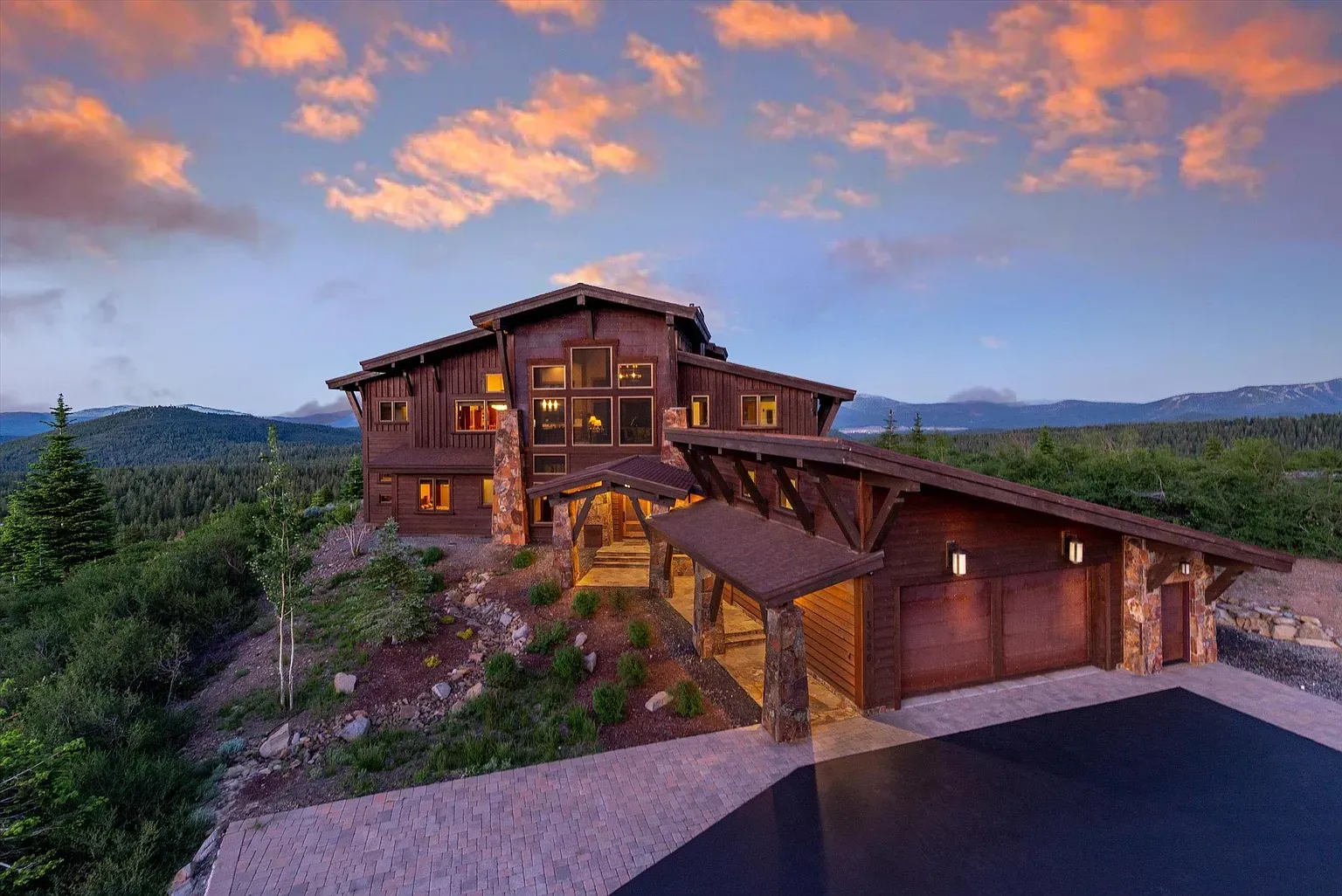 Wood and stone outside. Big windows. Feels a lodge with Wi‑Fi.