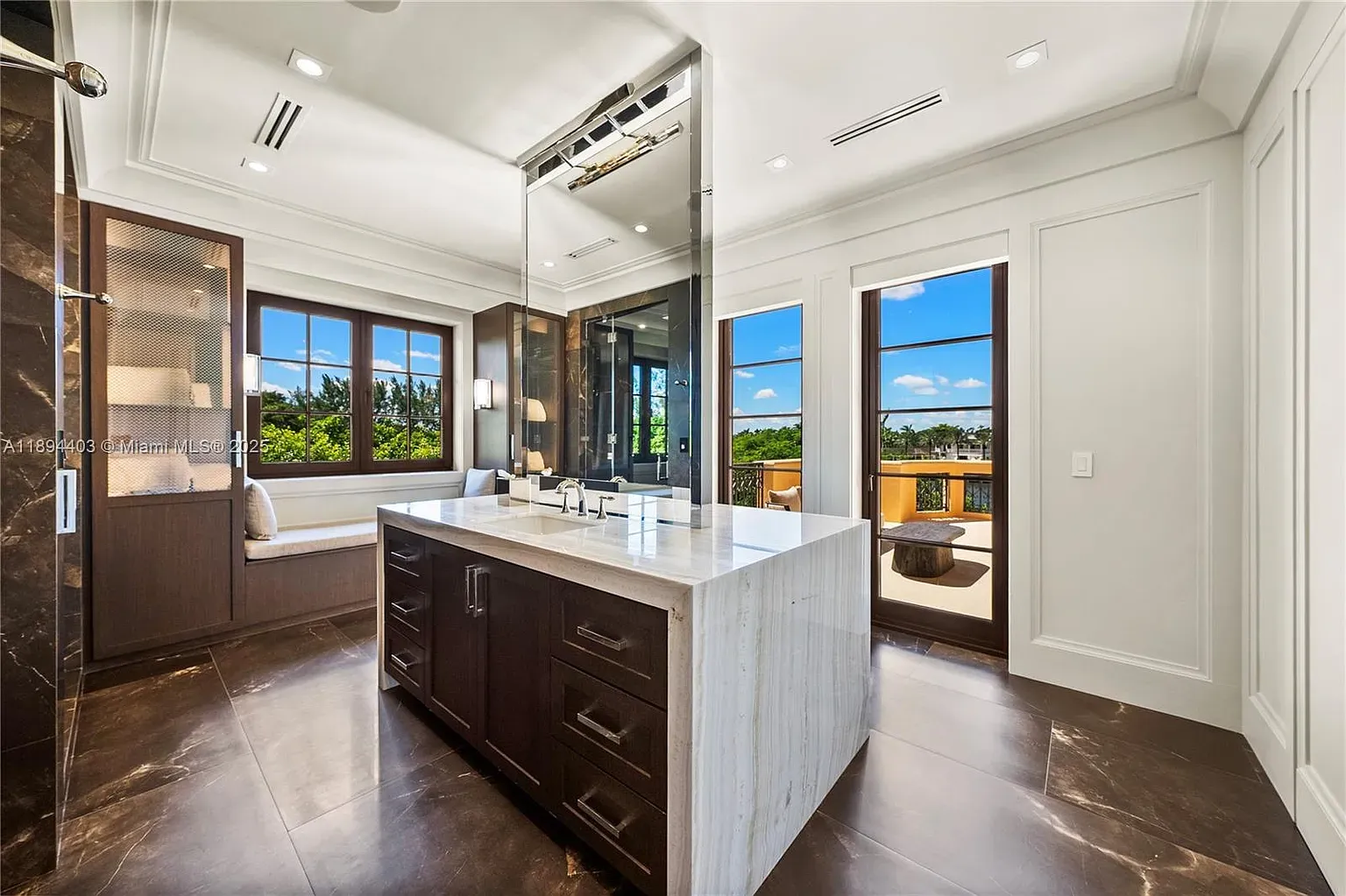 Marble double vanity, dark cabinets. Clean contrast, hotel bathroom energy.