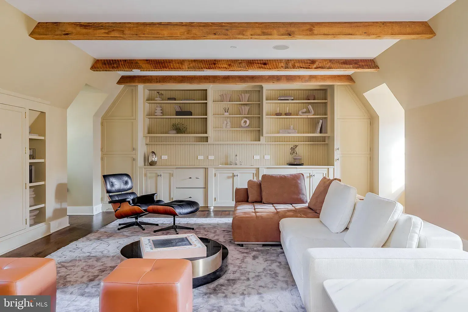 Big creamy sectional, wood accents. Feels nap central.