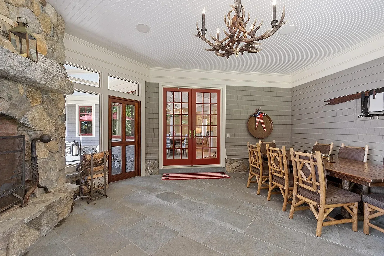 Stone fireplace again, plus antlers up top. Cabin chic unlocked.