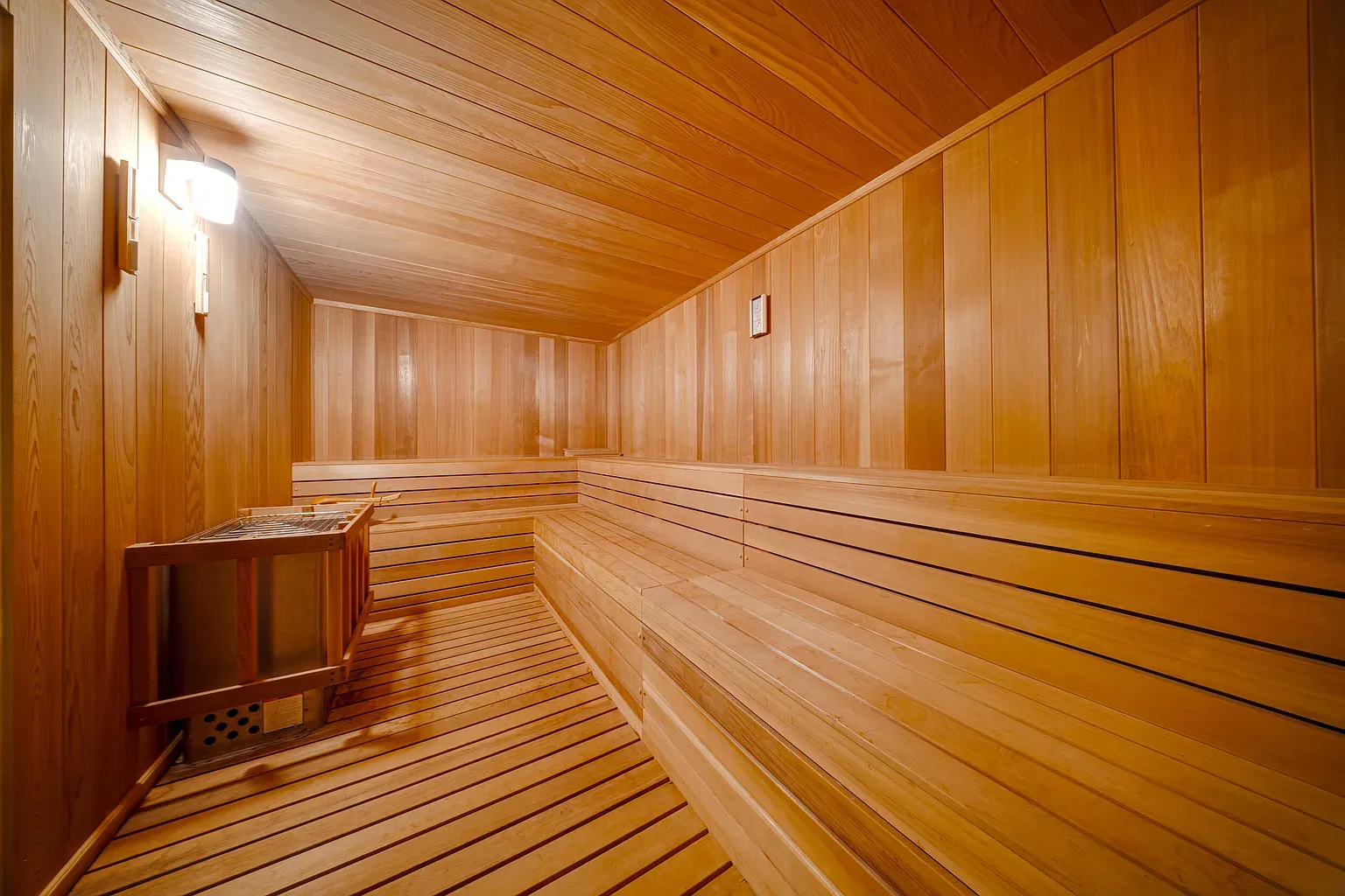 Tiny sauna glow-up—golden planks, simple benches, instant exhale.