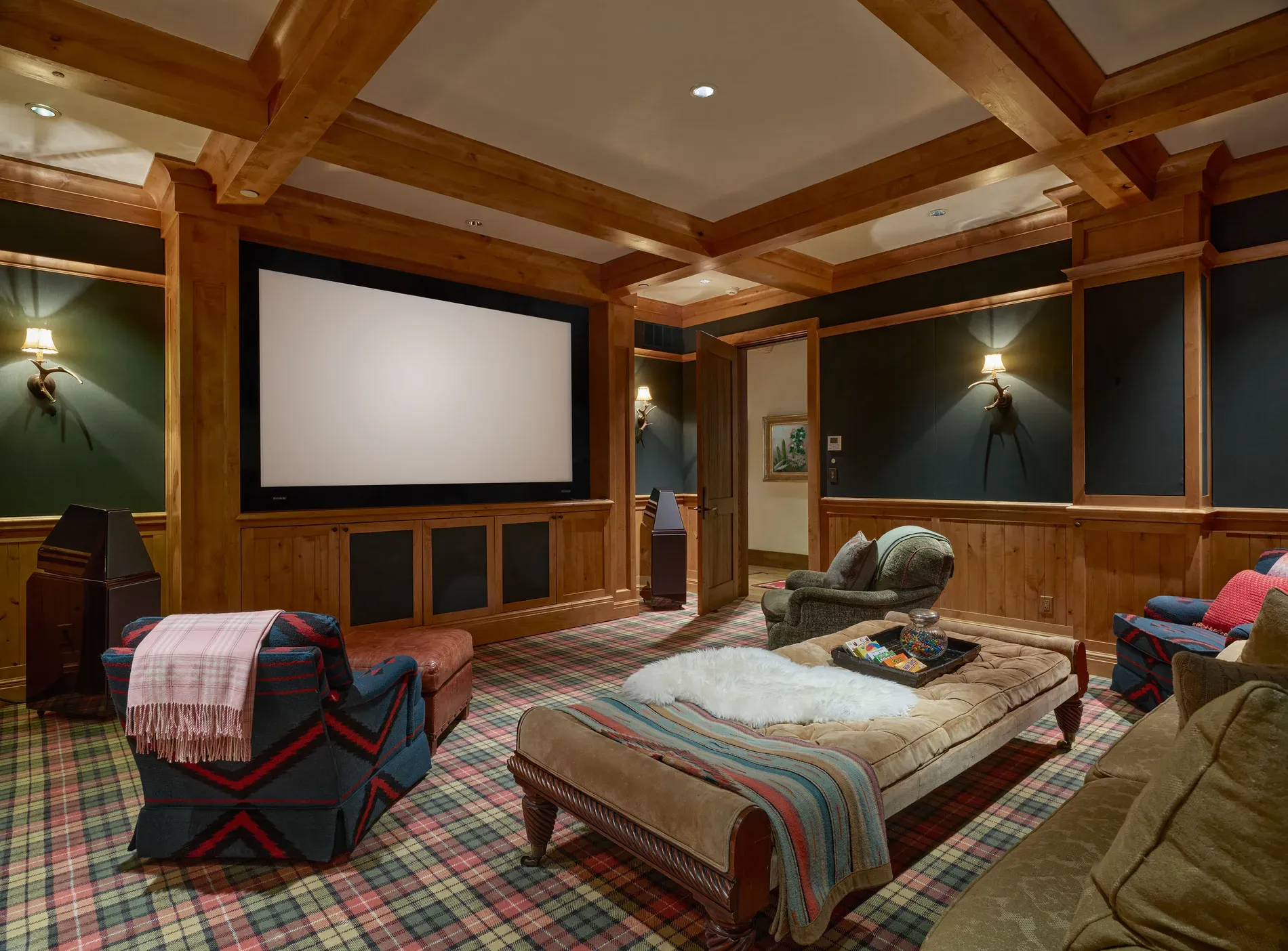 Media room in forest green. Not sure with all the wood, but cozy.