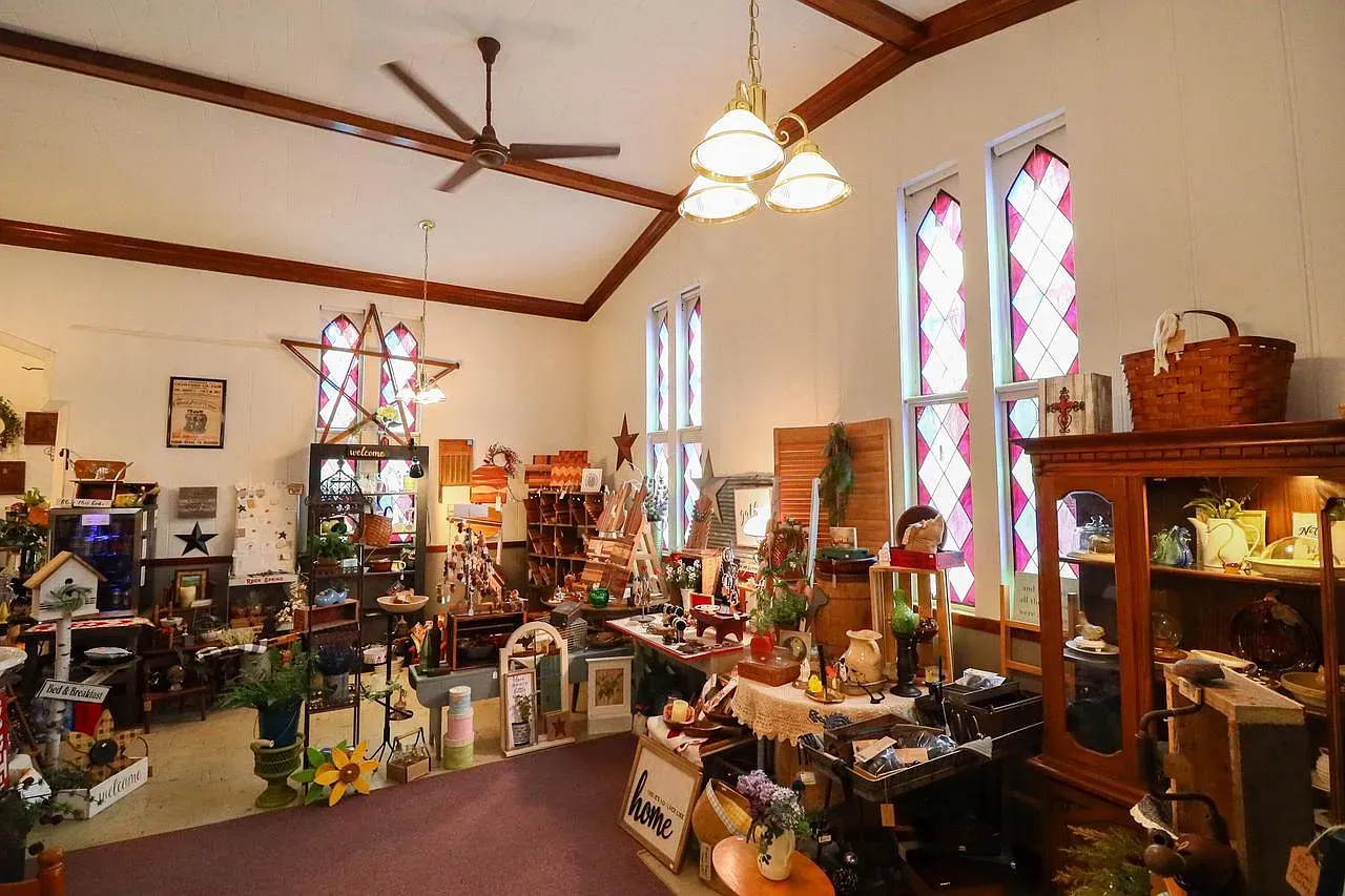 High ceilings, chunky beams, wood trim everywhere. Kinda nostalgic in the best way.