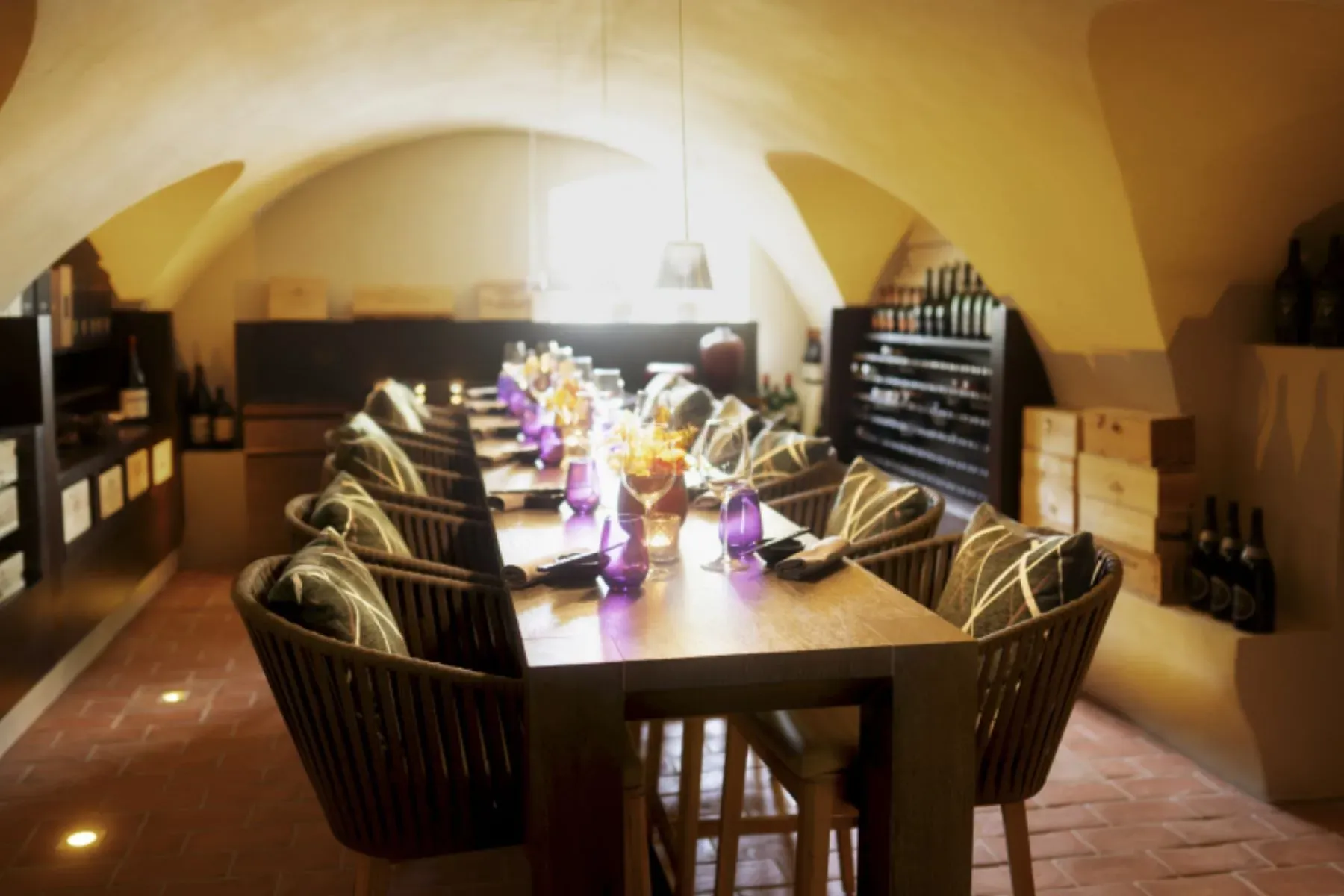 Long wooden table with quirky curved chairs. Family dinners forever.