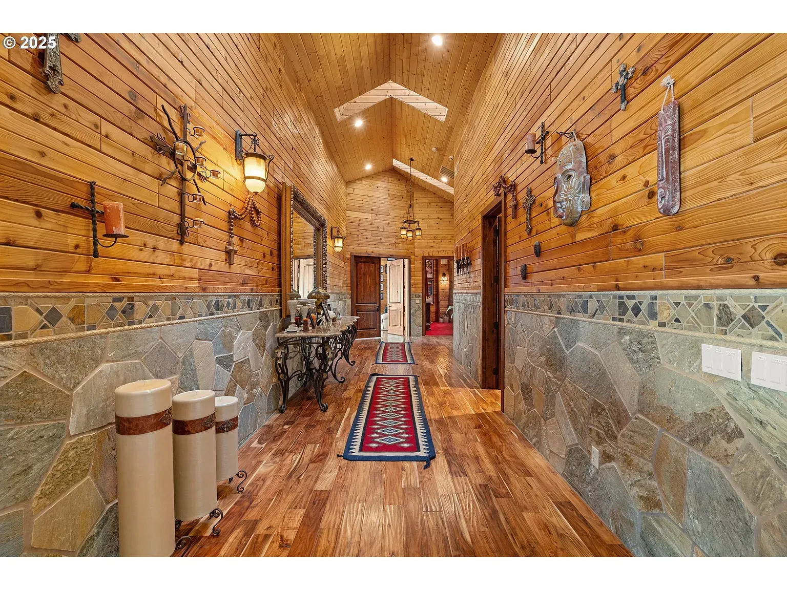 Another wood-lined hallway, now with a vaulted ceiling flex.
