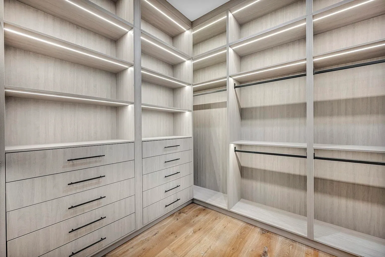 Closet is all pale wood and symmetry. Very zen, very organized.
