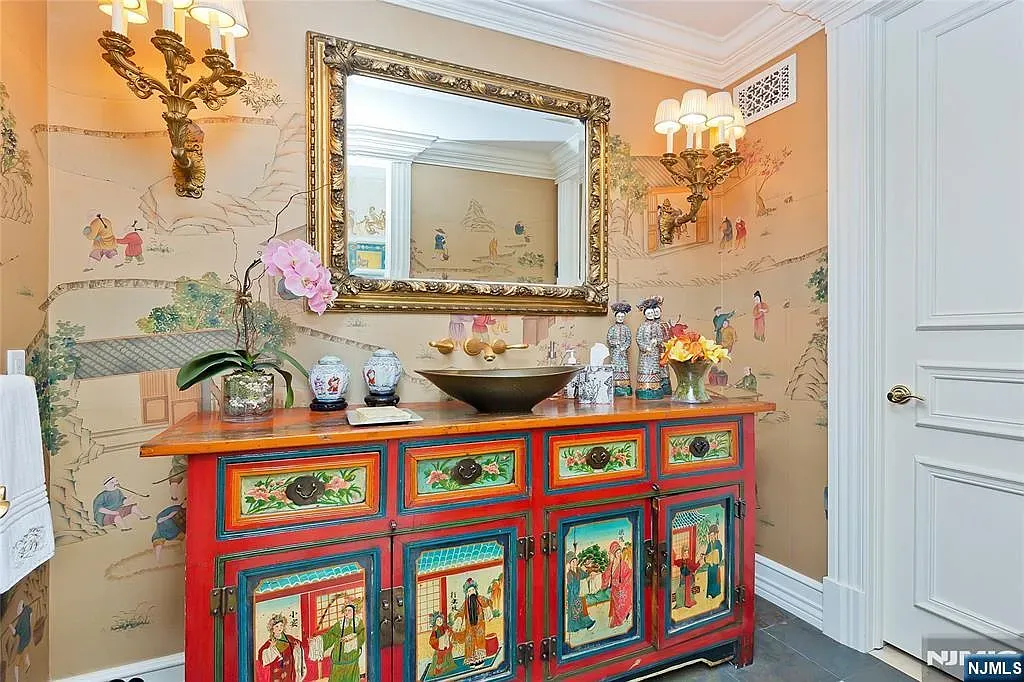 Red lacquer console with tiny paintings. Unexpected, but kinda awesome.