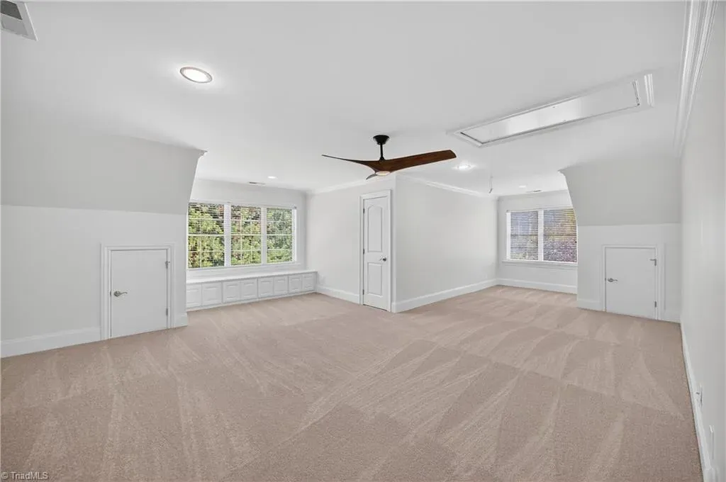 Big windows with crisp trim. That gray again, but it works here.