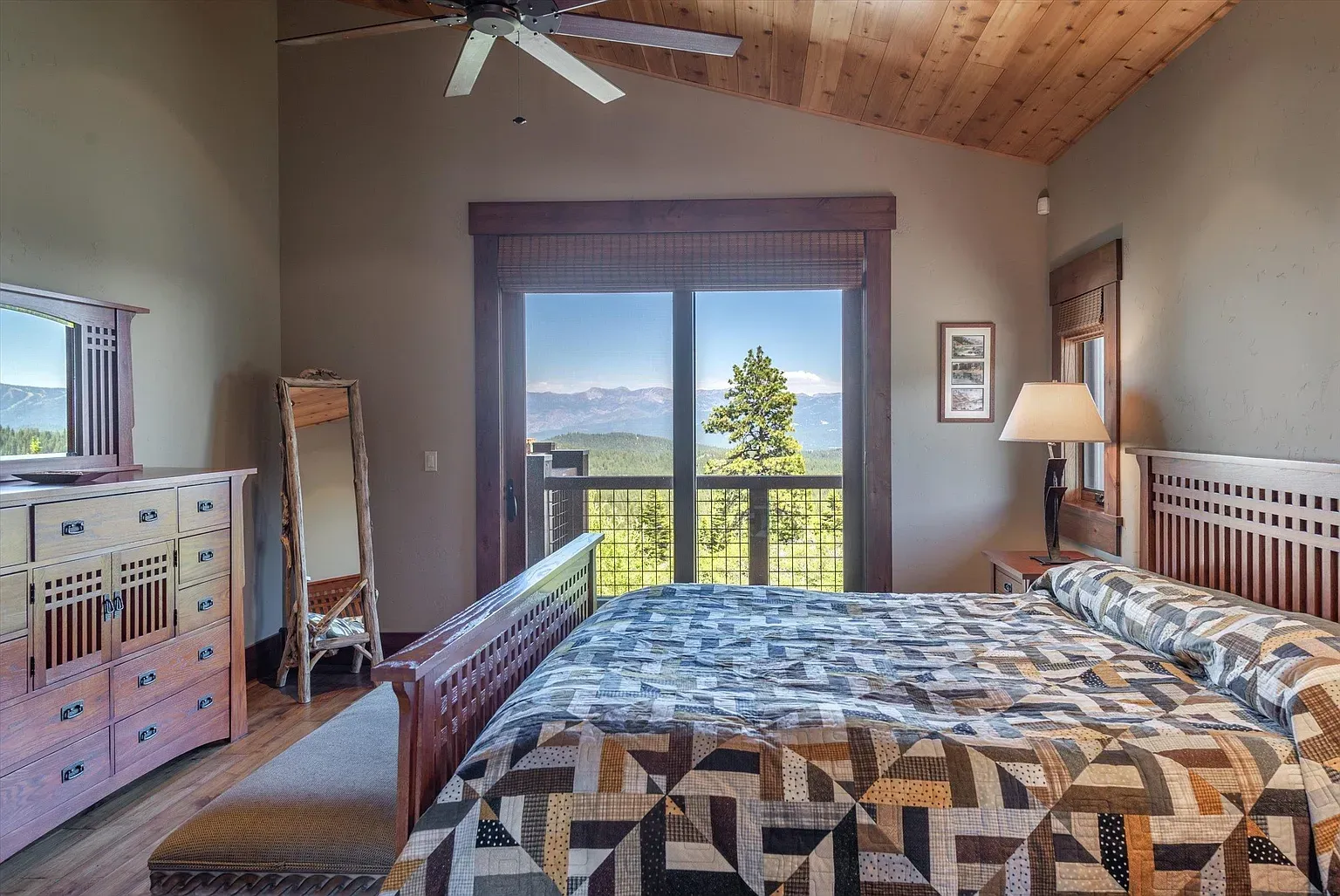 Bedroom with wood ceiling doing the cozy thing. Earthy walls, soft light.