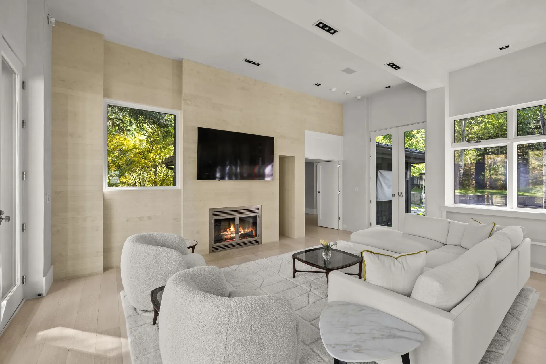 From this angle, creamy walls and that skinny fireplace strip. Cozy, a little showroom?