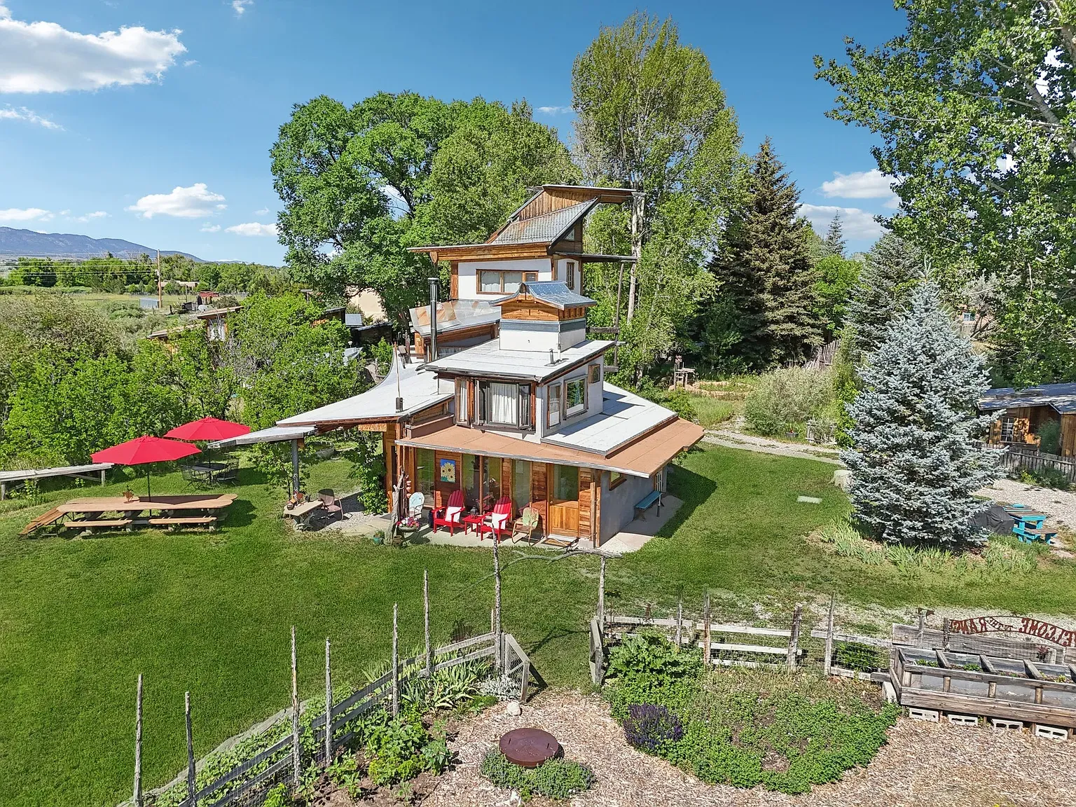 Contemporary layers tucked into the hill. Rustic wood plus sharp angles actually works.