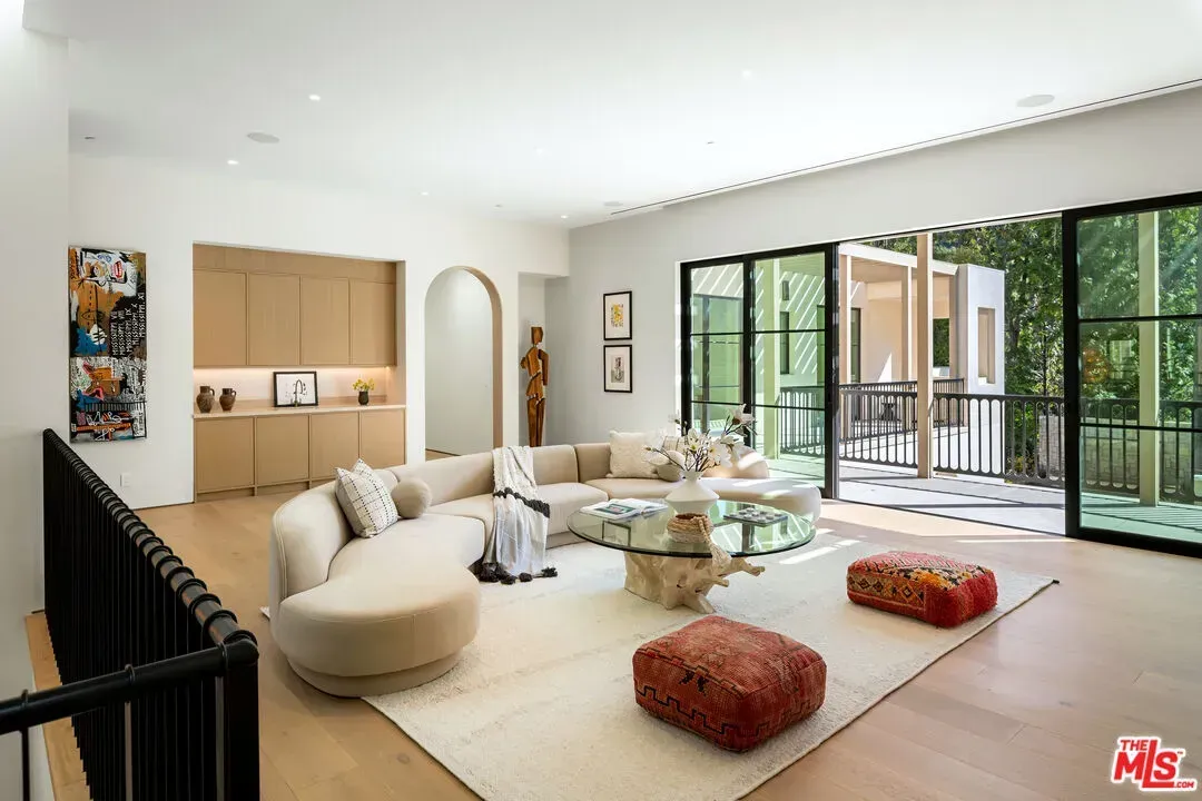 Living room flex. massive curved sofa. I mean, it’s cool, maybe too much?