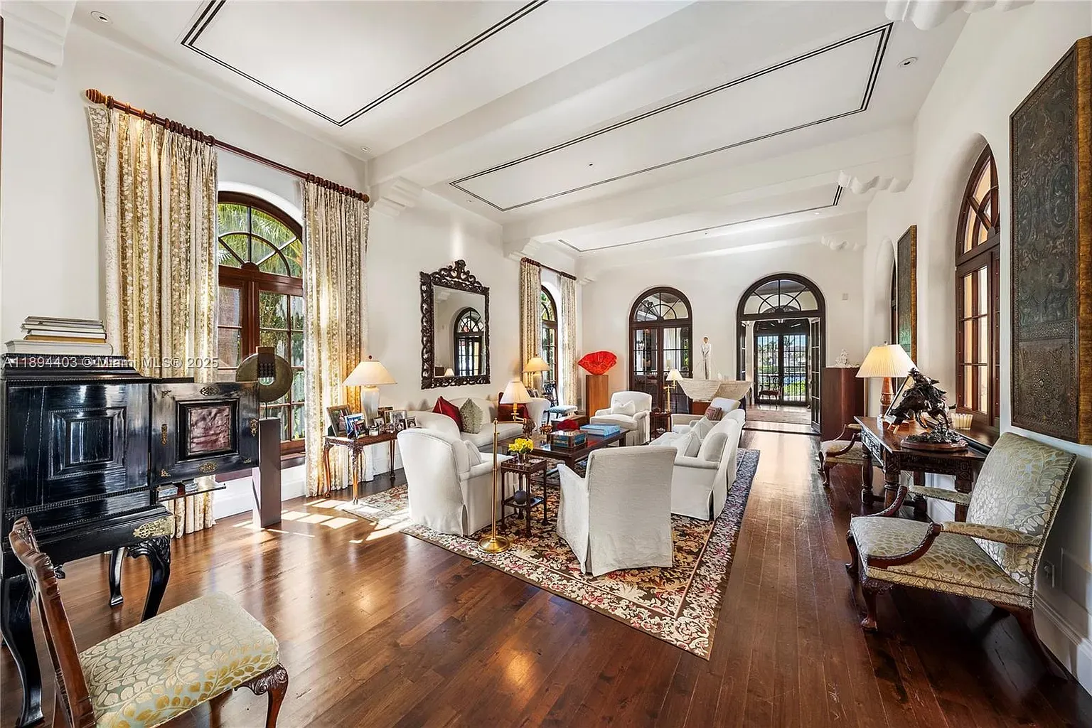 Living room goes grand. crown molding, recessed lights, huge openings. From this angle, airy.