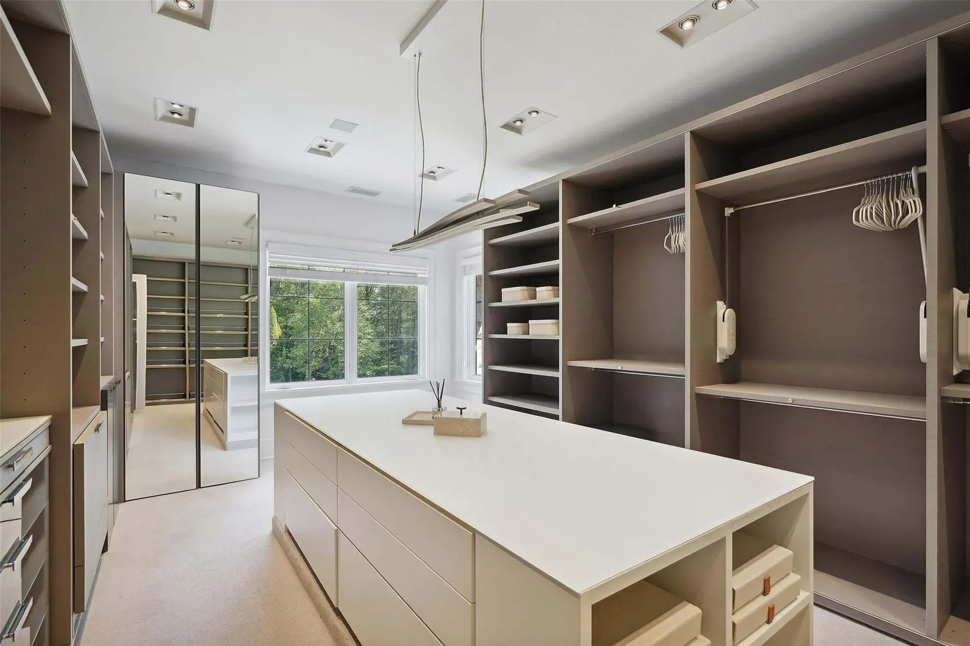 Closet island is massive. Anyone actually fold here or just stage shoes?