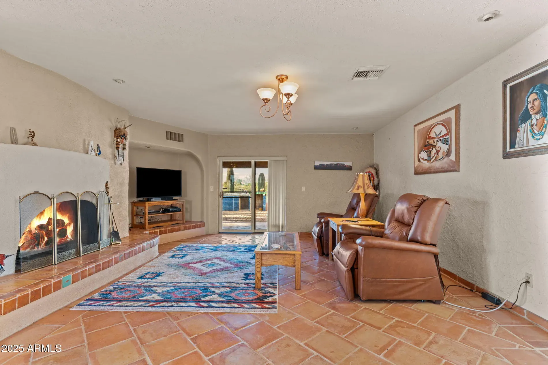 Living room keeps the tile theme. Soft walls, good light.