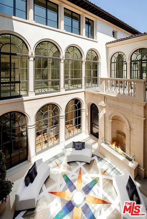 Courtyard feels serene—arched windows, soft tones. Echoes a monastery, but luxe.