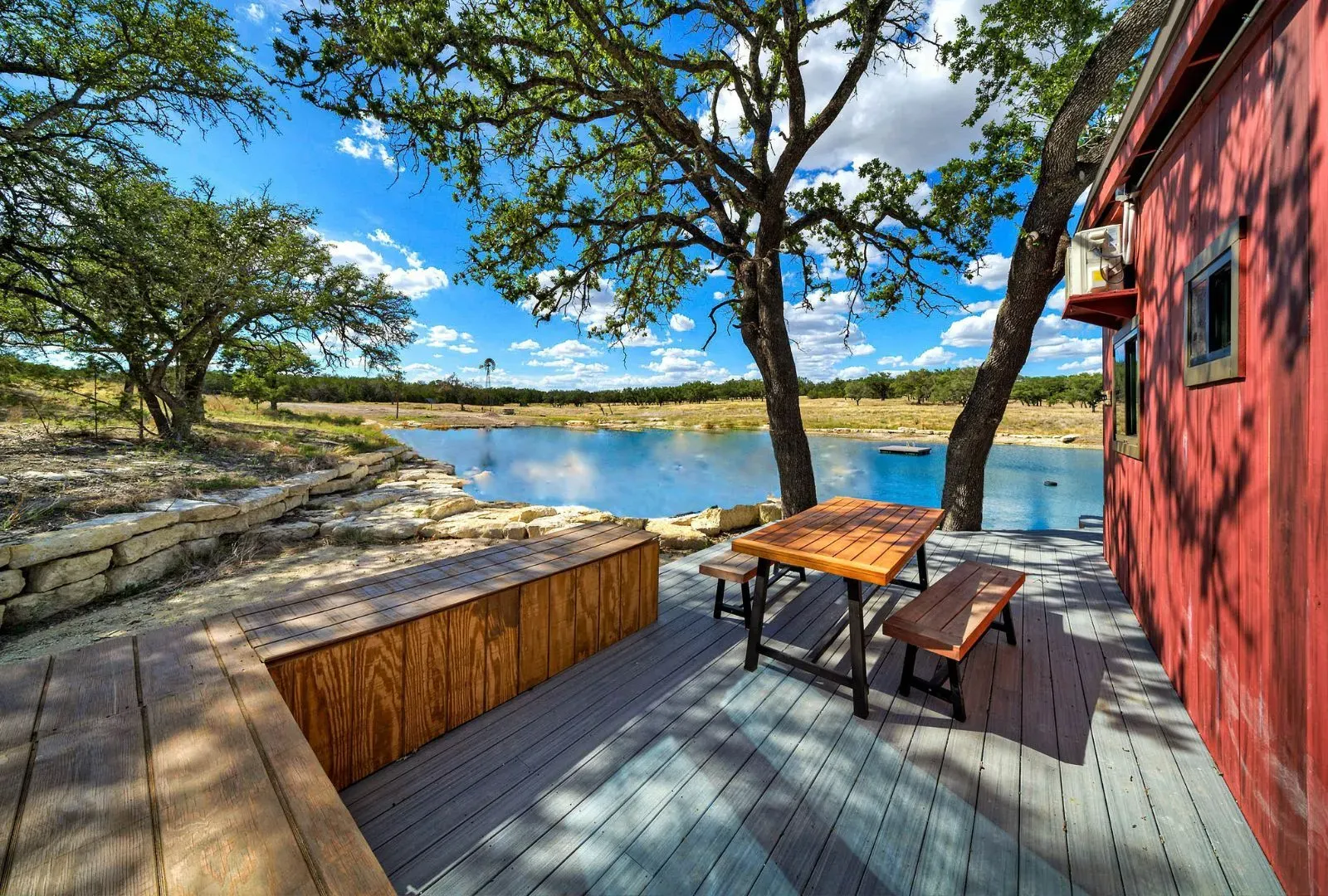 Wood deck with picnic table. Simple, warm, honestly my favorite spot so far.