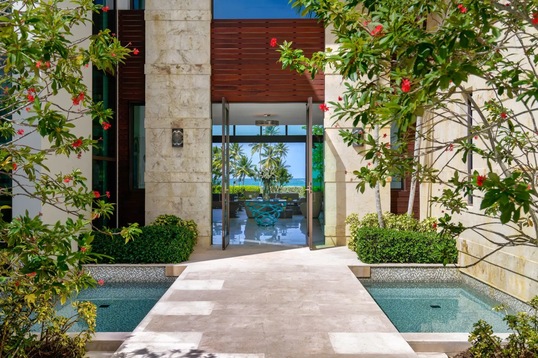 Entry path looks spa-like. neat stone tiles and fresh plants.