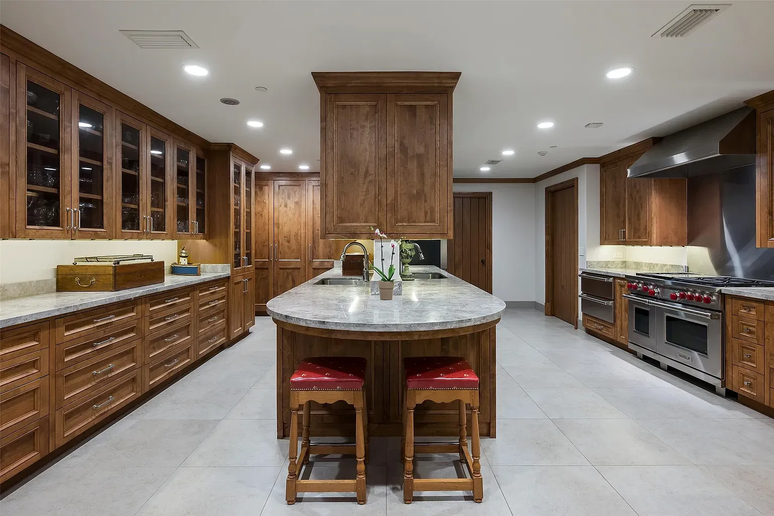 Second kitchen shot. Warm wood, speckled granite, lots of storage, lots of lights.