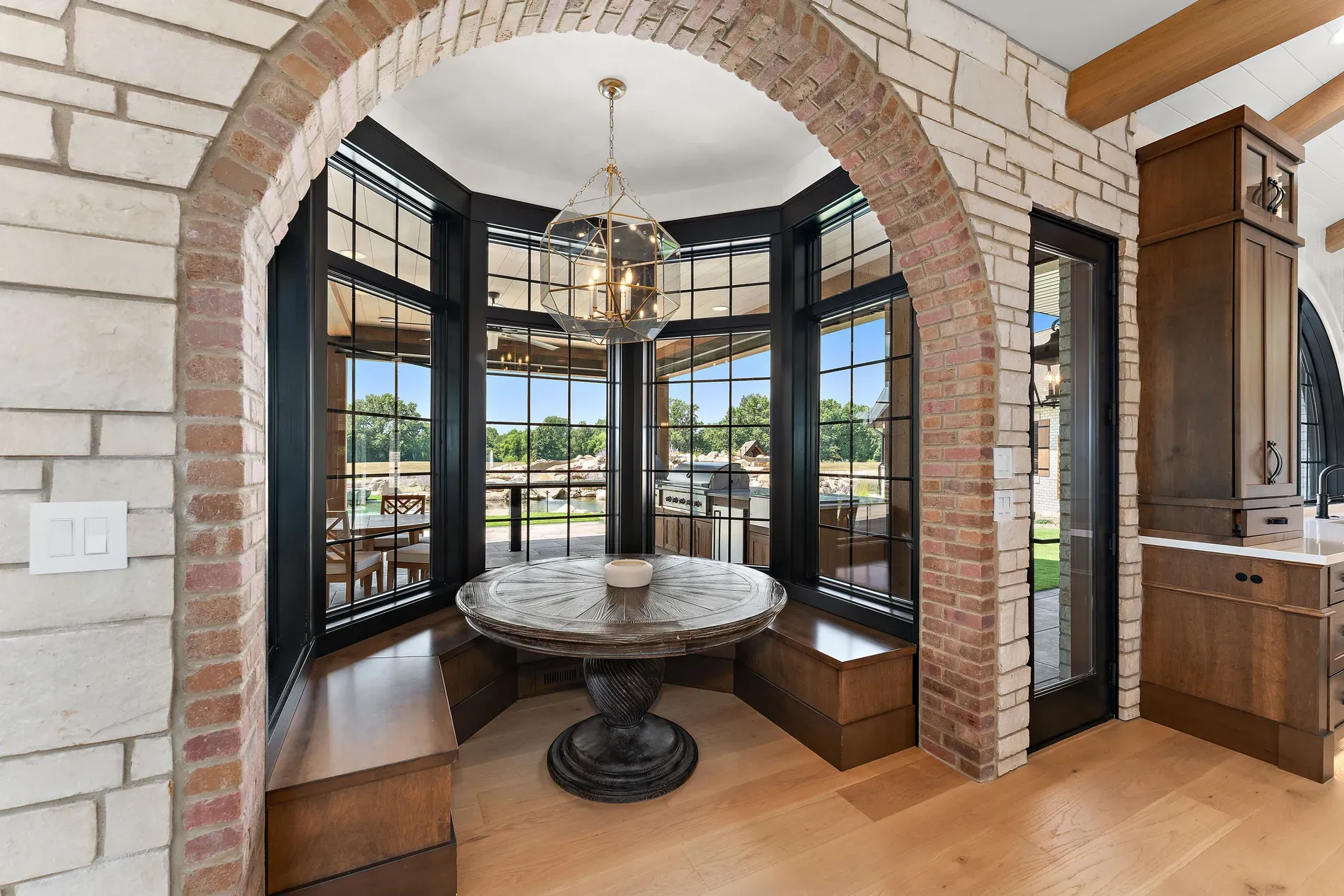 Arched brick moment around huge windows. Sit here and just watch the weather.