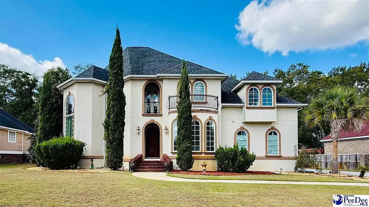 Beige stucco with a turret—storybook meets suburban.
