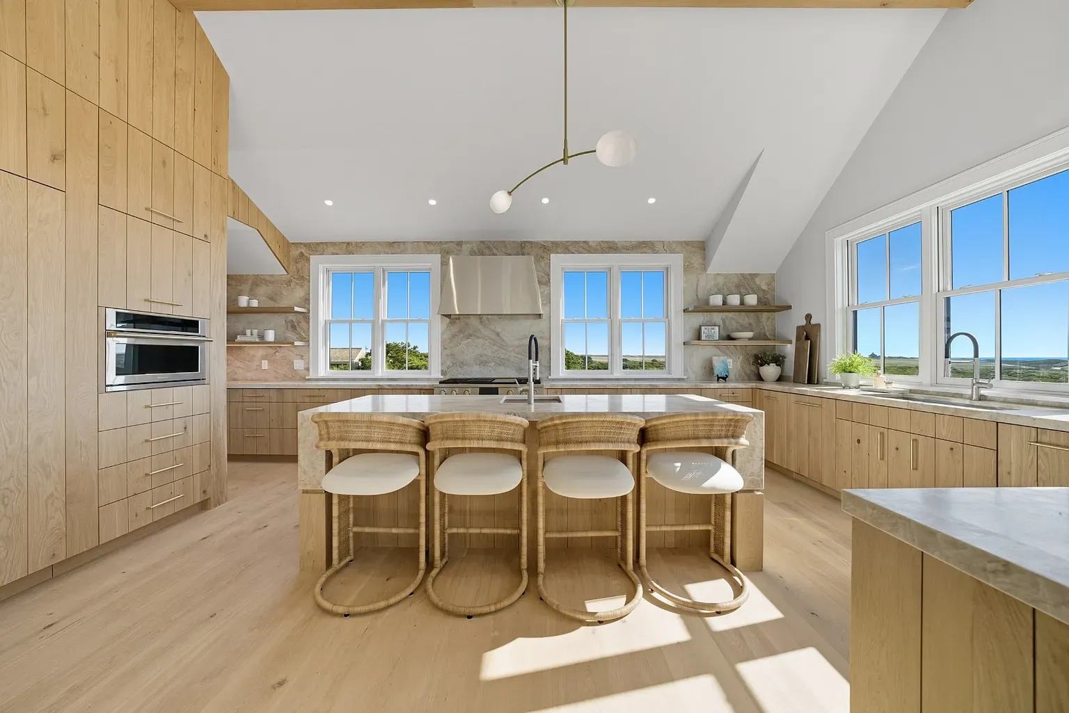 Here's the kitchen—warm wood everywhere. Not sure it's too much, but okay.