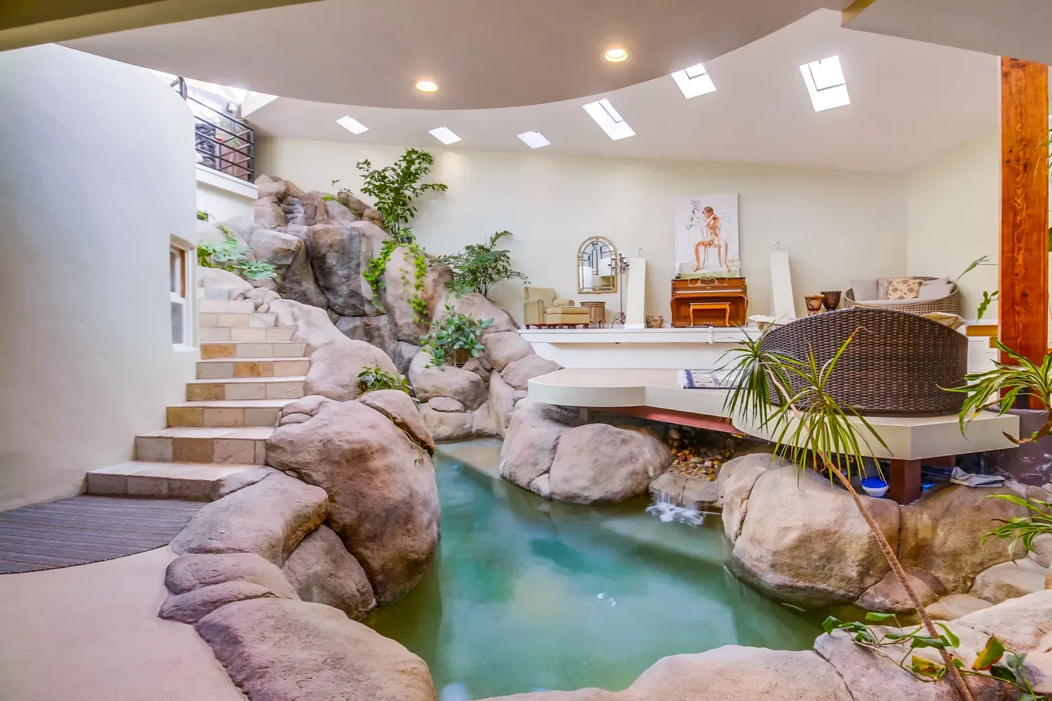 Indoor rocks with greenery climbing through. Very nature-core, but cool.