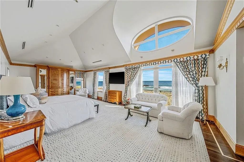 Vaulted ceiling and breezy drapes. Coastal, but not theme-park coastal.