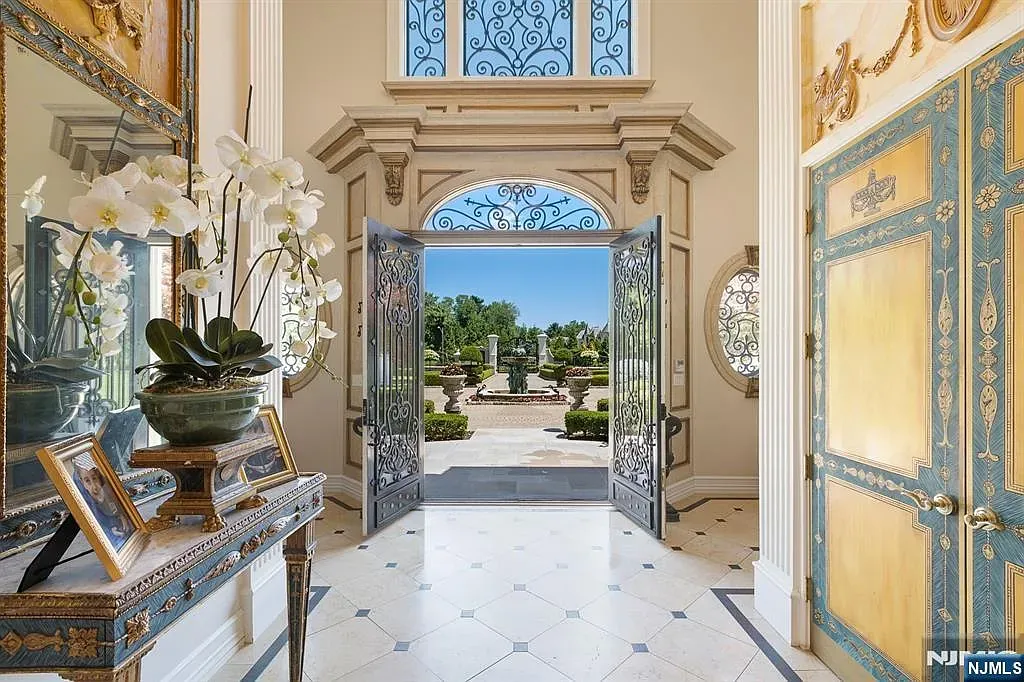 These gold-trimmed doors swing open to gardens. Okay, that reveal is dramatic.