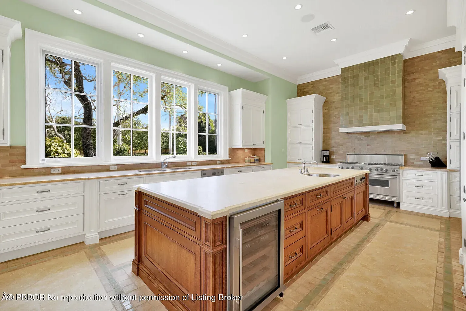 Here's the kitchen — chunky honey island, light counters, lots of breathing room.