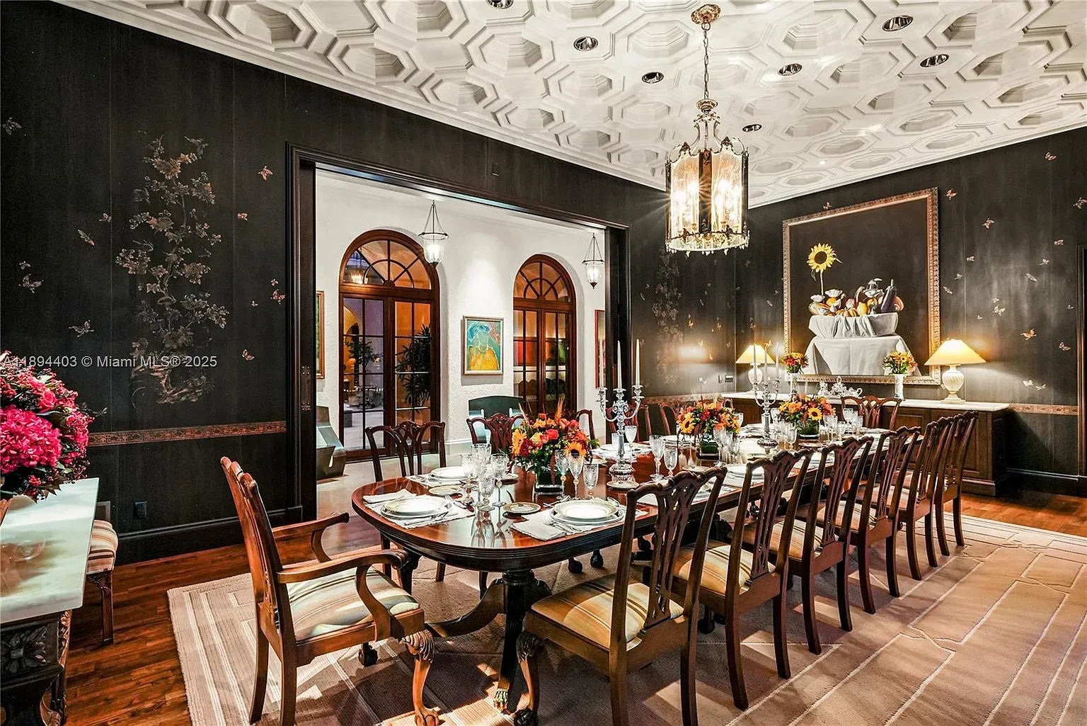 Black dining walls with floral—dramatic. Anyone know why they did this?