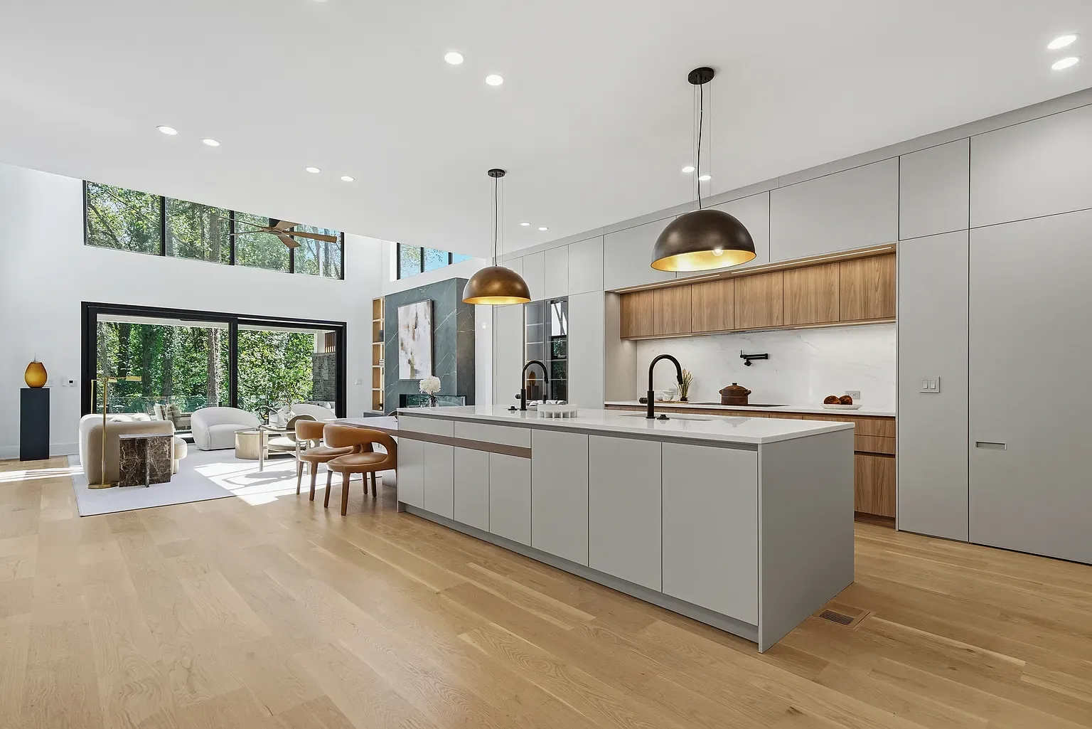 Kitchen goals. wall of glass, big island, trees basically in the room.