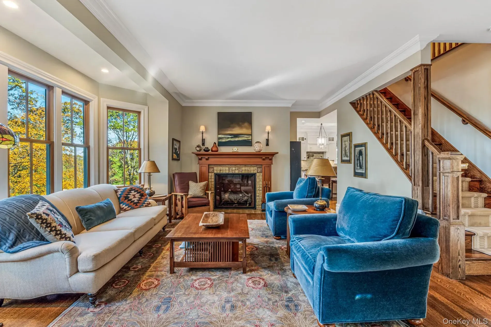 Earthy living room, big multi-pane windows, lots of light.