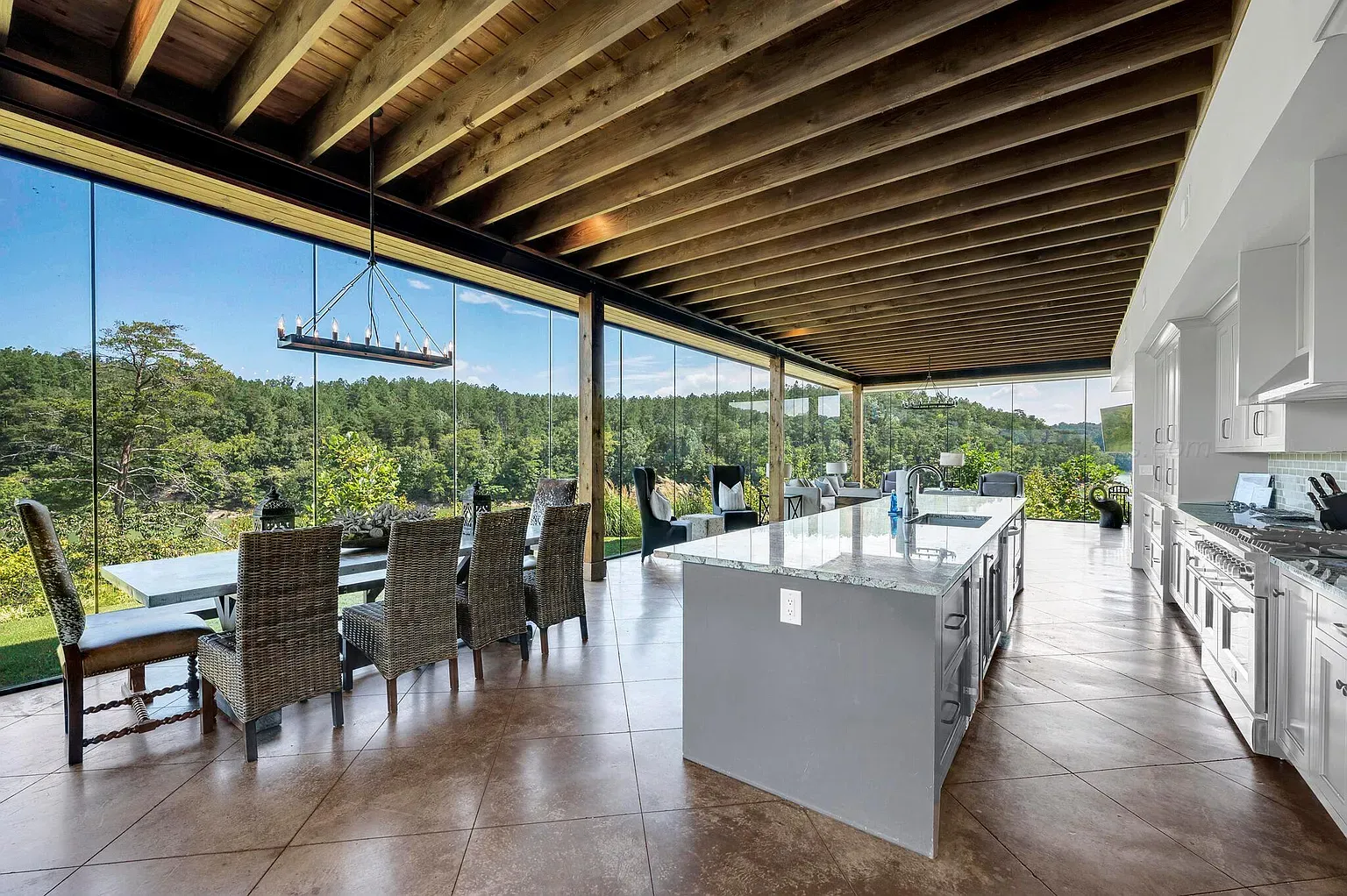 Open kitchen with hillside views. Cooking while staring at trees sounds perfect.
