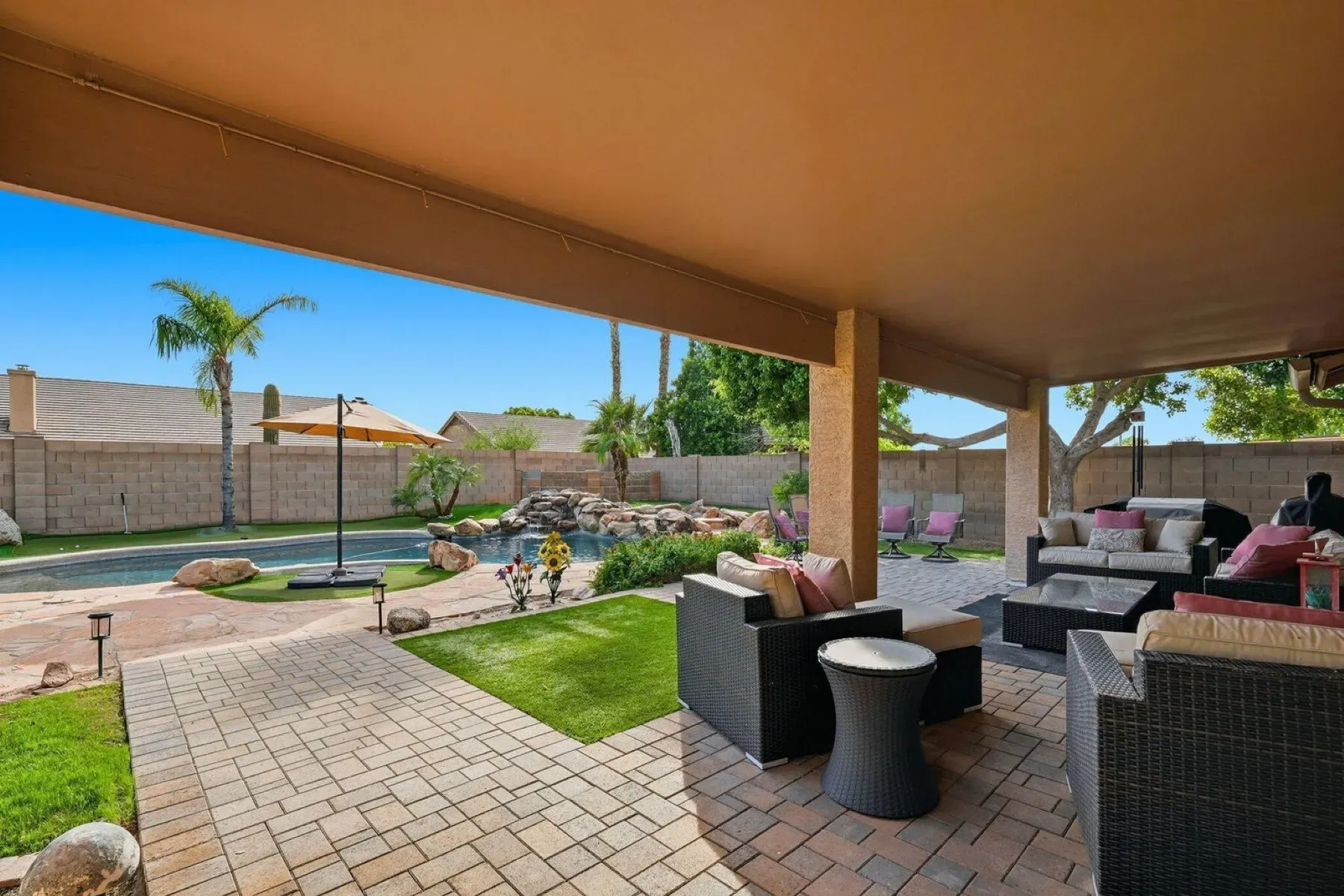Covered patio with ceiling fans, shade for days. I’d live out here.