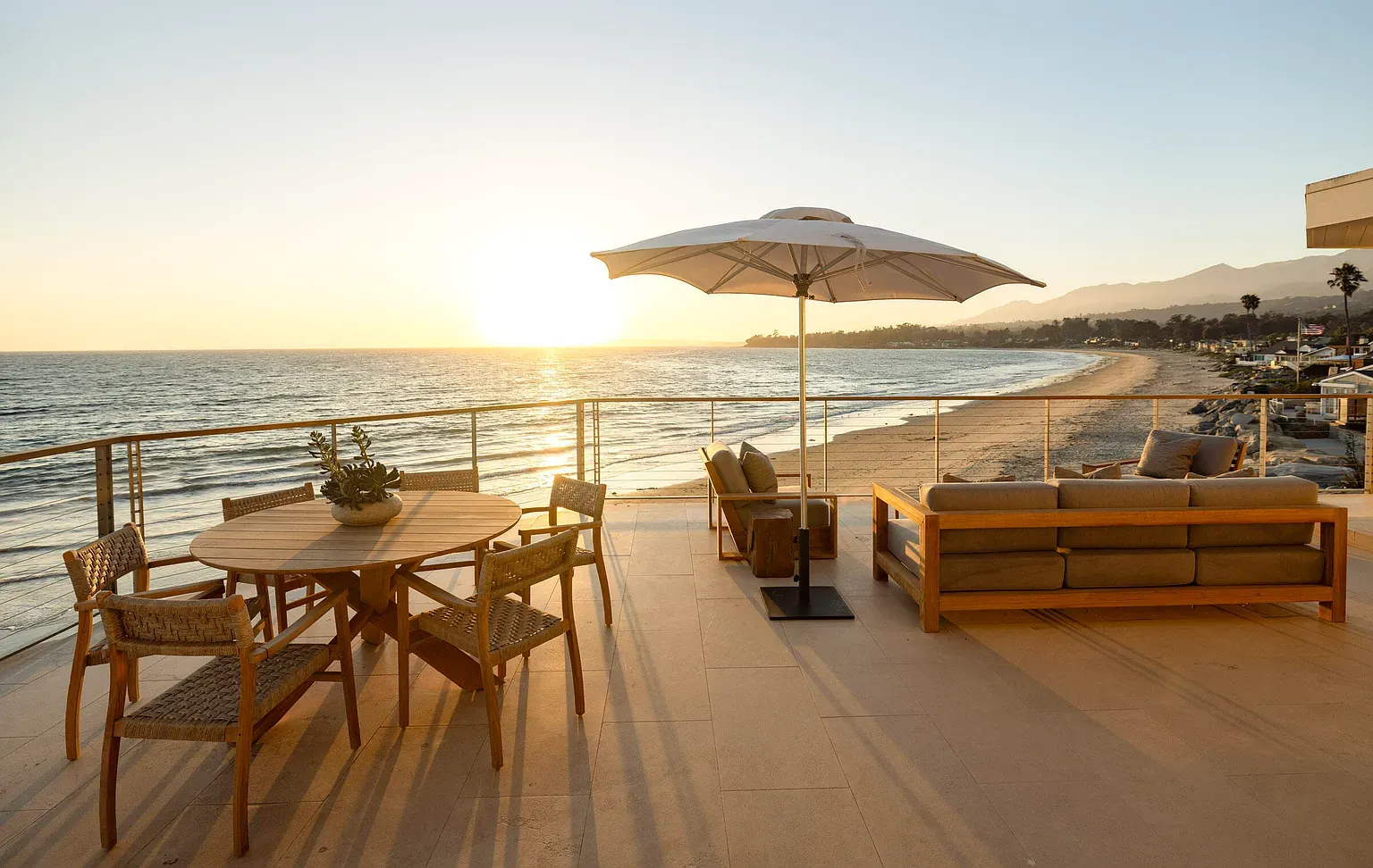 Glass railings keep the view honest. Sunsets carrying the show again.